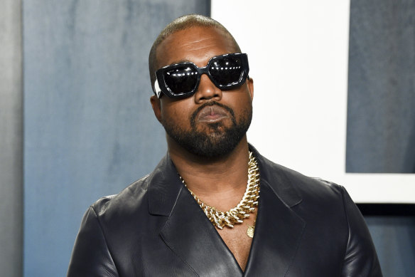 Kanye West, pictured in February at the Vanity Fair Oscar Party, has won his battle with Forbes to be judged a billionaire.