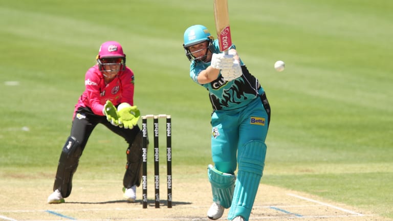 Going the tonk: Brisbane's Sammy-Jo Johnson belts a six against Sydney.