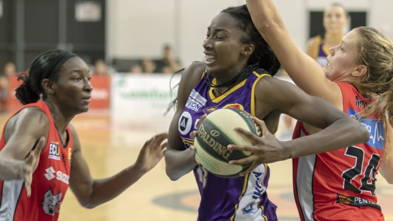 Centre point: Melbourne Boomers star Ezi Magbegor goes to the basket against Pertha Asia Taylor and Brittany McPhee. 