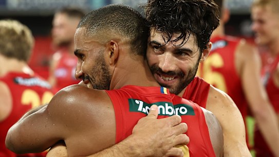 Petracca embraces teammate Touk Miller after the Norm Smith medallist’s stunning first game for the Suns.