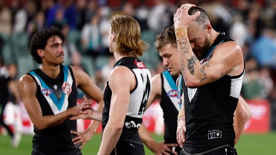 Charlie Dixon of the Power looks dejected after their loss against Geelong.