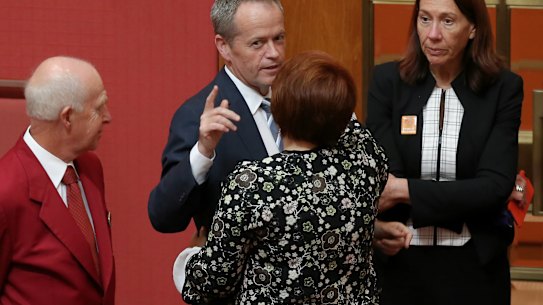 Senator Kimberley Kitching is congratulated by Opposition Leader Bill Shorten after delivering her first speech in the Senate in 2016. 