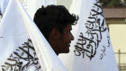 A man sells Taliban flags in Kabuly.