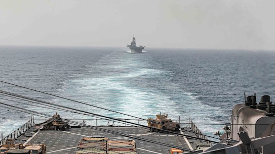 The amphibious dock landing ship USS Carter Hall and amphibious assault ship USS Bataan transit the Bab al-Mandeb strait in August.