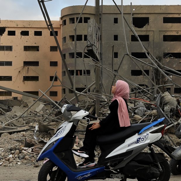 Manessa Ali, 10, surveys the damage in Dahiyeh, Beirut, in the aftermath of the October 5 Israeli strike on a medical facility on the airport road.