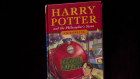 A first edition copy of Harry Potter and the Philosopher's Stone.