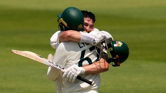 Australia’s Matt Renshaw celebrates his century with his teammate Nathan Lyon on day two.