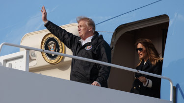 President Donald Trump and first lady Melania Trump arrive on Air Force One at Palm Beach airport en route to Mar-a-Lago for the weekend.
