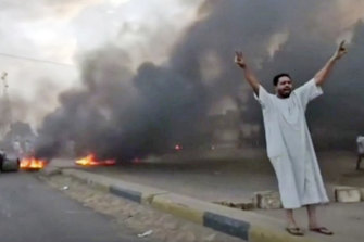 In this frame taken from video, a man protests after the military coup in Sudan. 
