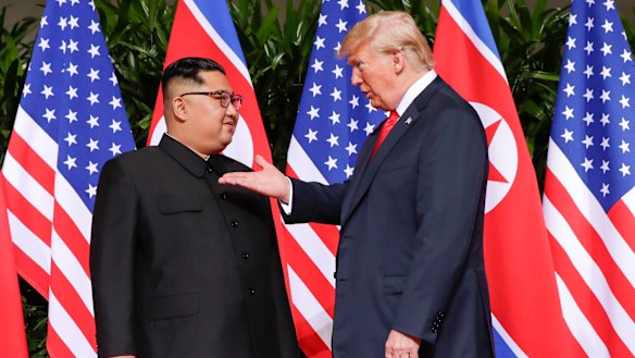 US President Donald Trump gestures towards the meeting site with North Korea leader Kim Jong-un at the Capella resort on Sentosa Island, Singapore.