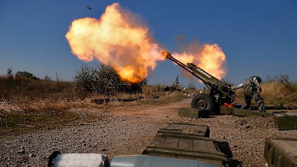 Pro-Russian rebels fire artillery towards Ukrainian positions on the outskirts of Donetsk in October 2014. Russia denied it sent arms and troops to support the separatists.