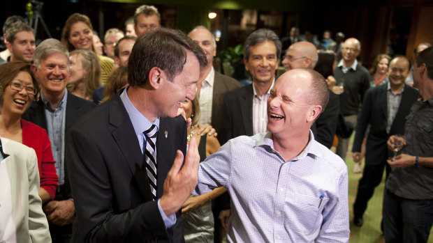 Lord mayor Graham Quirk and Campbell Newman celebrate after Cr Quirk won the election in 2012. 