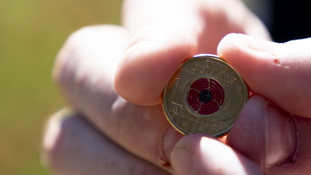 The new $2 coin, featuring a red poppy, produced to mark the centenary of the armistice that ended the First World War.