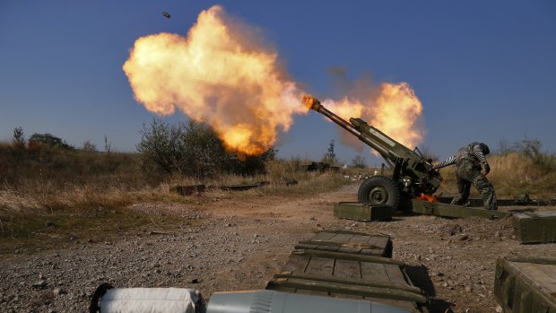 Pro-Russian rebels fire artillery toward Ukrainian positions on outskirts of Donetsk in October 2014. Russia denied it sent arms and troops to support the separatists.