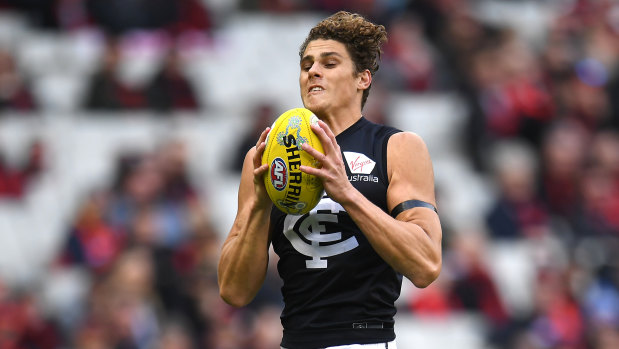 Safe hands: Charlie Curnow in action for Carlton during the round 11 clash against Essendon.