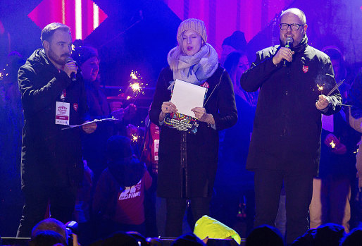 Gdansk Mayor Pawel Adamowicz, right, speaks to an audience shortly before he was stabbed in Gdansk, Poland.