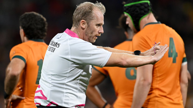 Referee Wayne Barnes penalises the Wallabies in the early moments of their World Cup loss to Wales.