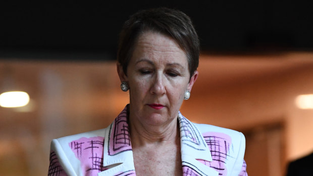 Queensland child safety minister Di Farmer arrives to address the media at Parliament House on Tuesday afternoon.