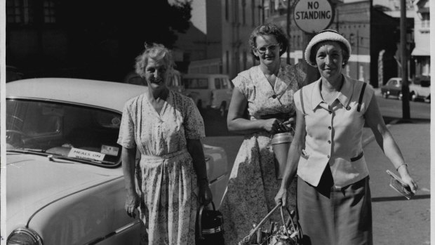 Here come the "angels" from left, Mrs. Gould, Mr. Jobling, Mrs. Henderson delivering meals in the South Sydney area. March 20, 1958.