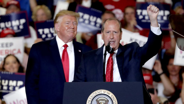 President Donald Trump, left, gives his support to Dan Bishop, right, a Republican running in the special North Carolina ballot.