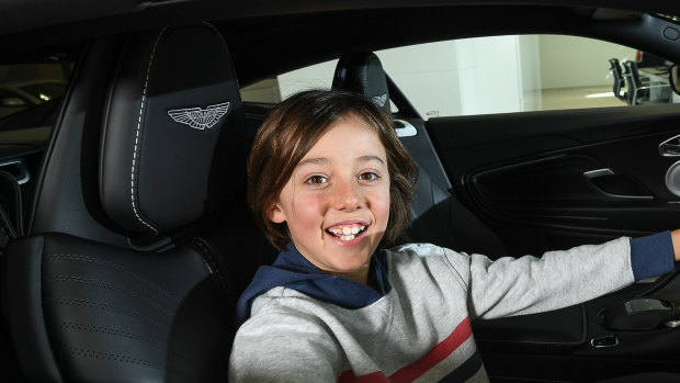 Luca from Little Big Shots sits behind the wheel of an Aston Martin DB11.