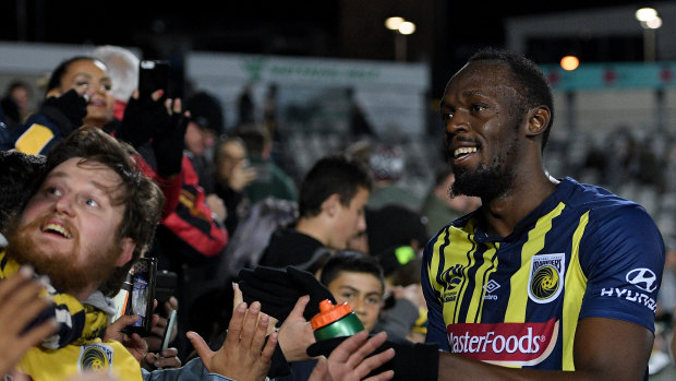 Fan favourite: Reactions have ranged from harsh to kind after Usain Bolt's debut, but the Mariners fans enjoyed the spectacle.