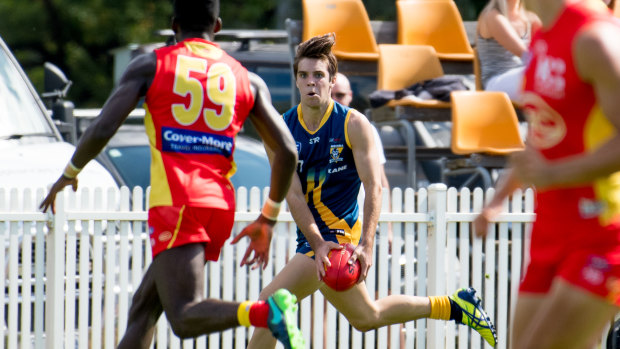 Canberra Demons player Rhys Pollock, centre, scored four goals for his side.