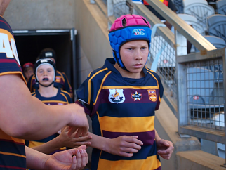 Panther cub ... Matt Burton runs out for St John’s JRLFC ahead of an under-13s Grand Final at Apex Oval in 2013. 