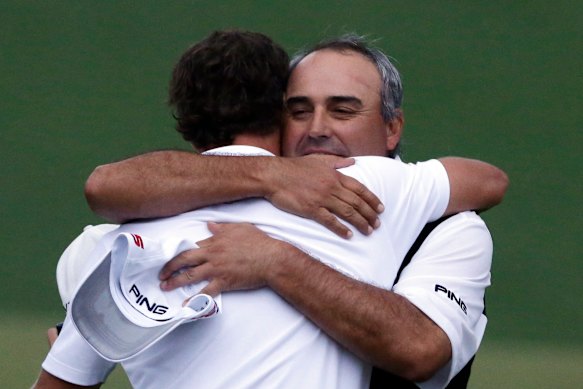 Angel Cabrera congratulates Adam Scott after the Australian won the 2013 Masters.