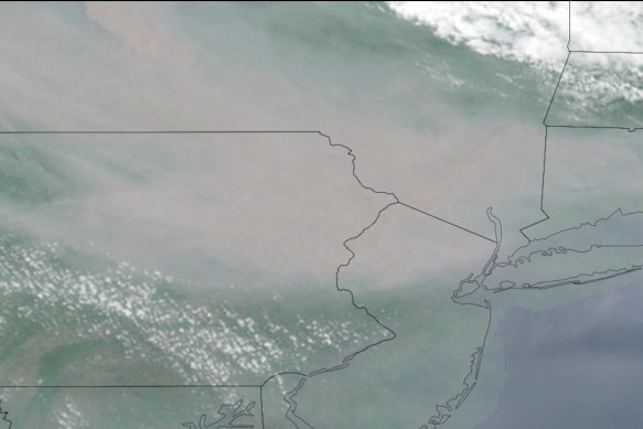 This satellite image taken on Wednesday shows smoke from Canadian wildfires drifting across parts of New York, New Jersey and Pennsylvania. 
