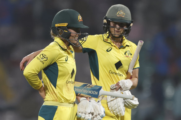 Ellyse Perry and Phoebe Litchfield celebrate Australia’s win over India during game two of the women’s T20I series.