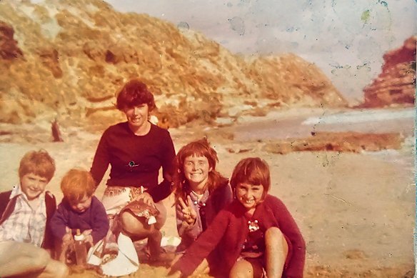 The writer (right) with family on the beach during her childhood.