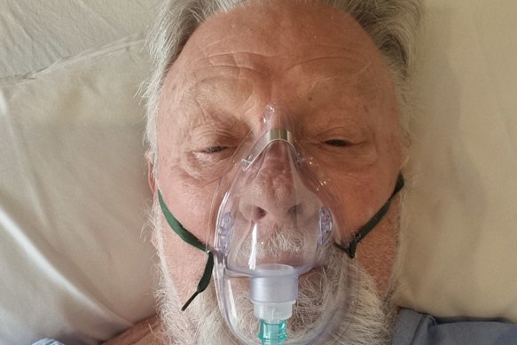 Damien Ryan in hospital after having heart bypass surgery.