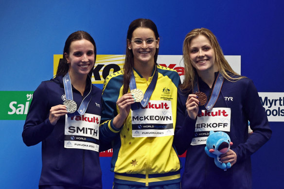 Australian Kaylee McKeown (centre) after one of her victories over American Regan Smith. 