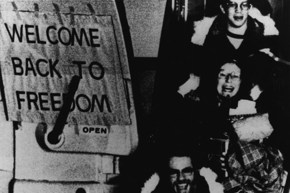 Free At Last -- American hostages released from Iran are all smiles as they arrive at an airport in West Germany following a flight from Algeria. February 26, 1981.