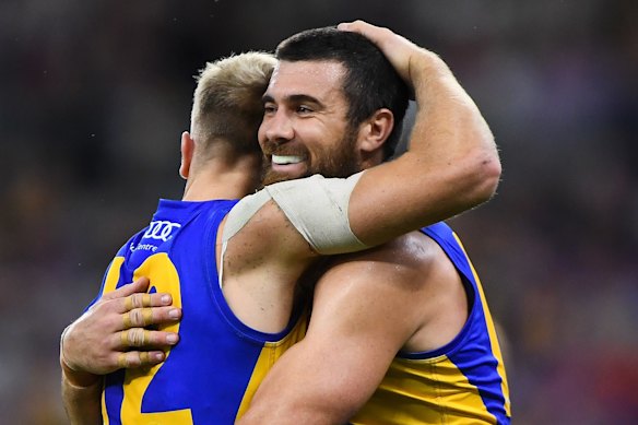 Oscar Allen and Josh Kennedy celebrate a goal.