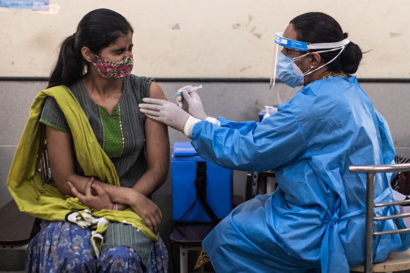 Around 2.1 million people are being vaccinated every day in India, but so far it’s not enough to curb infections. 