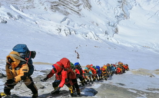 A queue of climbers along a path up Mount Everest, just below camp four in Nepal.
