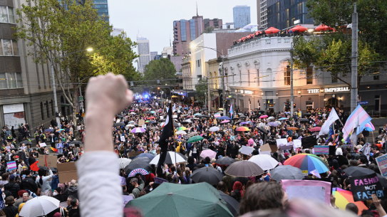 Protesters gather on the steps of Parliament House on Friday evening.
