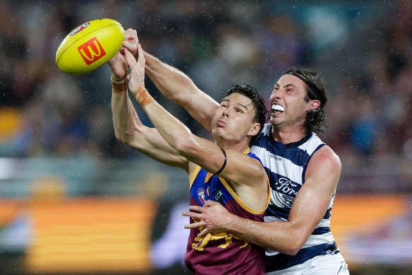 Jack Henry competes with Eric Hipwood in the Cats’ clash with the Lions recently.