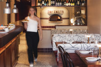 Bar Infinita inserts retro Italian touches into a modern setting, with a wood oven at its heart.