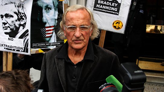 John Pilger talks to members of the media after meeting Julian Assange at the Ecuadorian embassy in London in 2012.