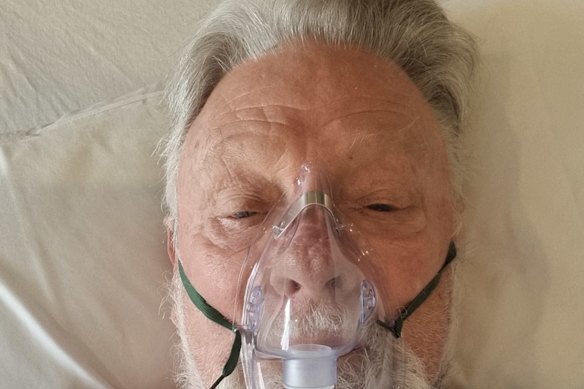 Damien Ryan in hospital after having heart bypass surgery.