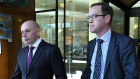 Citigroup lawyers Dean Jordan, from Forbes Chambers, left, and Andrew Eastwood, from Herbert Smith Freehills, leave the Downing Centre Courts in Sydney.
