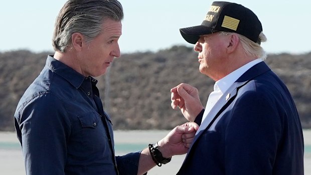Wo are you calling stupid? Gavin Newsom greets Donald Trump at Los Angeles International Airport last year.