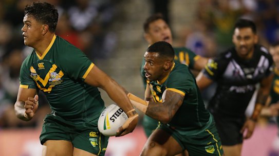 In green and gold: Latrell Mitchell on the fly for Australia in Wollongong against New Zealand.