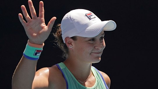 Ash Barty waves to the crowd after beating Petra Kvitova in straight sets.