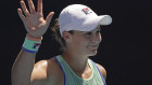Ash Barty waves to the crowd after beating Petra Kvitova in straight sets.