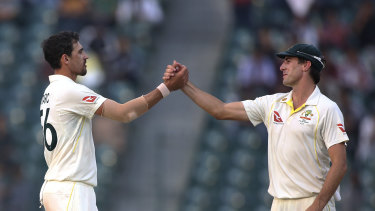 Mitchell Starc and Pat Cummins on day three of the Lahore Test. 