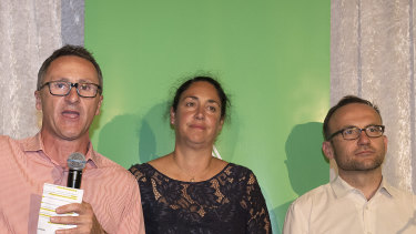 Greens leader Richard Di Natale (left), Greens candidate for Batman Alex Bhathal (centre) and deputy leader Adam Bandt concede defeat in Batman. 